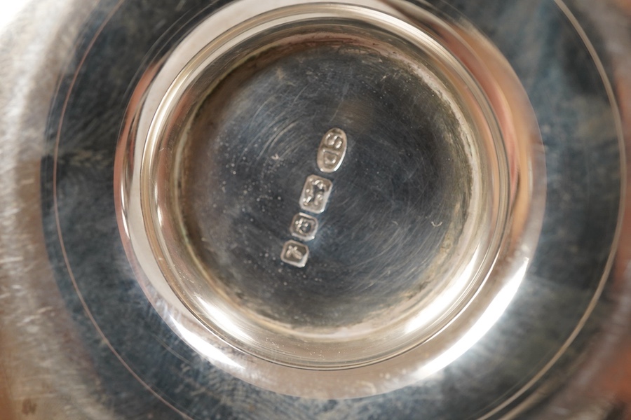 A group of assorted small silver including an Elizabeth II small circular dish by Stuart Devlin, London, 1985, diameter 13.5cm, a sauceboat, a 1920's seven bar toastrack, two pedestal salts including late Victorian, an e